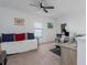 Comfortable living area with a daybed and an open workspace area at 6017 Maidenstone Way, Palmetto, FL 34221
