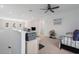 Bright living area with open staircase, desk and comfortable seating area at 6017 Maidenstone Way, Palmetto, FL 34221
