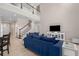 Bright, open-concept living space with stair case to 2nd floor, a large sofa and lots of light at 6017 Maidenstone Way, Palmetto, FL 34221