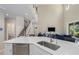 Bright open-concept living space featuring a great staircase, high ceilings and a great kitchen island at 6017 Maidenstone Way, Palmetto, FL 34221