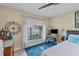 Well-lit bedroom with a desk, fan and a large window providing plenty of natural light at 6412 Sun Eagle Ln, Bradenton, FL 34210