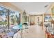 Breakfast nook with a glass table and backyard views offering seamless indoor-outdoor living at 6412 Sun Eagle Ln, Bradenton, FL 34210