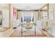 Chic dining room featuring modern furniture and a large window with garden views at 6412 Sun Eagle Ln, Bradenton, FL 34210