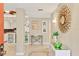 Open foyer featuring travertine floors, stylish decor, and views of the kitchen at 6412 Sun Eagle Ln, Bradenton, FL 34210