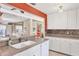 The kitchen features granite countertops, white cabinets, and an open layout concept at 6412 Sun Eagle Ln, Bradenton, FL 34210