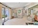 Bright living room with tile floors, comfortable seating, and a sliding glass door leading to the outdoors at 6412 Sun Eagle Ln, Bradenton, FL 34210