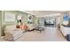 Bright living room with lots of seating, neutral tones, tile flooring and natural light at 6412 Sun Eagle Ln, Bradenton, FL 34210
