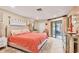 Cozy bedroom with a large bed, neutral tones, and access to a private outdoor area at 6412 Sun Eagle Ln, Bradenton, FL 34210