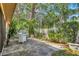The patio area is surrounded by lush trees and greenery, offering a private and relaxing outdoor space at 6412 Sun Eagle Ln, Bradenton, FL 34210