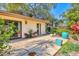 The spacious patio features vibrant potted plants, creating a tropical oasis for outdoor living and entertaining at 6412 Sun Eagle Ln, Bradenton, FL 34210