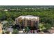 Stunning aerial view of the building and its lush green surroundings with a golf course nearby at 6465 Watercrest Way # 404, Lakewood Ranch, FL 34202