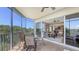 Screened-in balcony overlooking the community, with access to indoor living spaces at 6465 Watercrest Way # 404, Lakewood Ranch, FL 34202