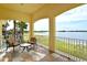 Balcony with seating and serene lake views, perfect for relaxing outdoors at 6465 Watercrest Way # 404, Lakewood Ranch, FL 34202