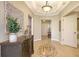 Elegant foyer with tile flooring, decorative accents, and a view into the home's open layout at 6465 Watercrest Way # 404, Lakewood Ranch, FL 34202
