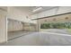 This large garage has room for storage and parking, with a view of the landscaping outside the complex at 6465 Watercrest Way # 404, Lakewood Ranch, FL 34202