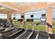 Gym area with treadmills and large windows providing scenic views during workouts at 6465 Watercrest Way # 404, Lakewood Ranch, FL 34202