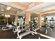 Well-equipped gym featuring weight machines and treadmills with expansive mirrored walls at 6465 Watercrest Way # 404, Lakewood Ranch, FL 34202