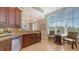 Kitchen with granite countertops, stainless appliances and a breakfast nook with a view at 6465 Watercrest Way # 404, Lakewood Ranch, FL 34202