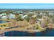 Aerial view of a waterfront community with lush landscaping, a golf course, and a pond at 6748 Fairview Ter # 4-202, Bradenton, FL 34203