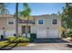 Charming townhome with attached garages, manicured landscaping, and a tile roof at 6748 Fairview Ter # 4-202, Bradenton, FL 34203