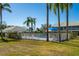 Community pool area with palm trees and well-maintained landscaping at 6748 Fairview Ter # 4-202, Bradenton, FL 34203