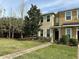 Inviting townhouse with manicured lawn, complemented by a welcoming walkway and verdant trees at 7006 Spotted Deer Pl, Riverview, FL 33578