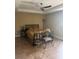 Bedroom with tiled floors, ceiling fan, and decorative metal bed frame at 7286 Mineola Rd, Englewood, FL 34224