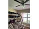 Bedroom features a bunk bed and ceiling fan at 7286 Mineola Rd, Englewood, FL 34224