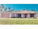 Charming single-story home with a well-maintained front lawn and attached garage at 7286 Mineola Rd, Englewood, FL 34224