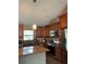 Well-equipped kitchen with ample cabinetry, granite countertops and stainless steel appliances at 7286 Mineola Rd, Englewood, FL 34224