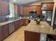 Beautiful kitchen with stainless steel appliances, an island, and granite countertops at 7286 Mineola Rd, Englewood, FL 34224