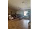 Relaxing living room with cozy furniture and a ceiling fan for added comfort at 7286 Mineola Rd, Englewood, FL 34224