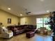 Relaxing living room with cozy furniture and a ceiling fan for added comfort at 7286 Mineola Rd, Englewood, FL 34224
