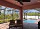 Screened-in pool area with brick pavers and ceiling fan at 7286 Mineola Rd, Englewood, FL 34224