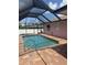 Backyard pool with a screen enclosure at 7286 Mineola Rd, Englewood, FL 34224