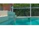 Inviting swimming pool with cascading waterfall feature, perfect for relaxation and outdoor enjoyment at 7424 Arrowhead Run, Lakewood Ranch, FL 34202