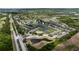 Panoramic aerial shot showcases the property within a community with ponds and lush greenery at 7593 Plantation Cir, Bradenton, FL 34201