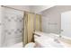Bathroom featuring tile accents, large mirror, and a shower-tub combination at 7593 Plantation Cir, Bradenton, FL 34201
