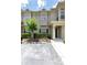 Inviting townhome exterior with a well-manicured lawn and private parking at 7593 Plantation Cir, Bradenton, FL 34201