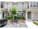 Inviting townhome exterior with a well-manicured lawn and private parking at 7593 Plantation Cir, Bradenton, FL 34201