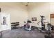 Community gym equipped with free weights, machines, and ample space at 7593 Plantation Cir, Bradenton, FL 34201