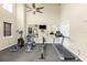 Well-equipped fitness center with various exercise machines and a high ceiling at 7593 Plantation Cir, Bradenton, FL 34201