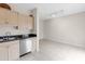 Bright kitchen with stainless steel dishwasher and sink and a view of the adjacent living space at 7593 Plantation Cir, Bradenton, FL 34201