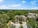 Overhead view of a townhome with two-car garages and abundant green trees at 8209 72Nd E St, University Park, FL 34201
