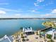 Scenic view of a lakefront plaza with seating, pedestrian bridge, and stylish architecture at 8209 72Nd E St, University Park, FL 34201