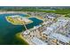 Expansive aerial view of the community showcasing the lake, walking paths, green spaces, and diverse housing options at 8209 72Nd E St, University Park, FL 34201