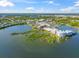 An aerial view of the town center and surrounding areas featuring lush landscapes, lakes and waterways at 8209 72Nd E St, University Park, FL 34201
