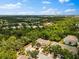 Wide aerial view of community, lakes, and wooded landscape at 8209 72Nd E St, University Park, FL 34201