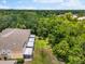 A spacious backyard with a large lawn and screen lanai's offering tranquil views at 8209 72Nd E St, University Park, FL 34201