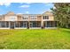 Beautiful backyard featuring lush green grass and screened in patios at 8209 72Nd E St, University Park, FL 34201